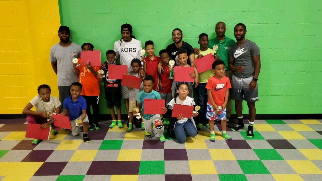 CWA youth wrestlers with trophies after a tournament